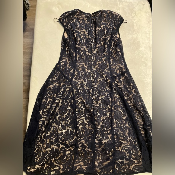 Black lace dress with nude background - Picture 5 of 6